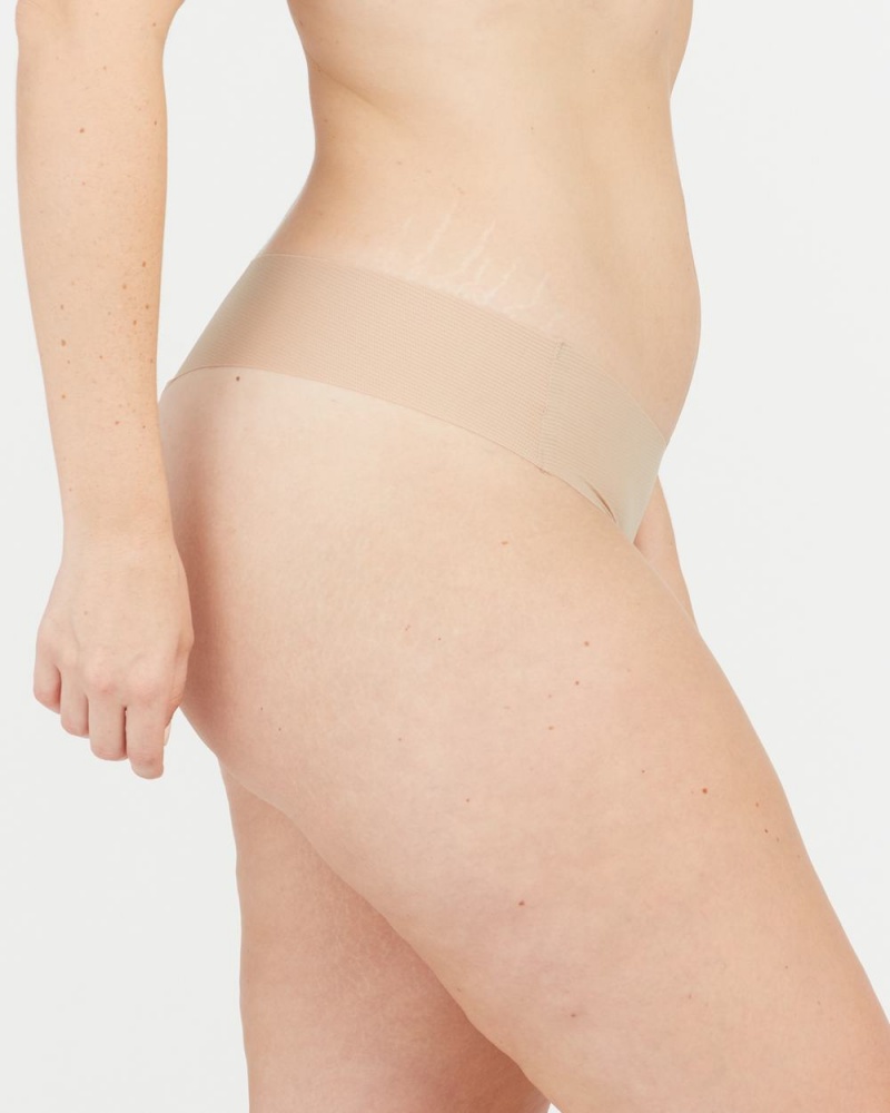 Beige Spanx Under Statements® Thong | DKAMI-8742